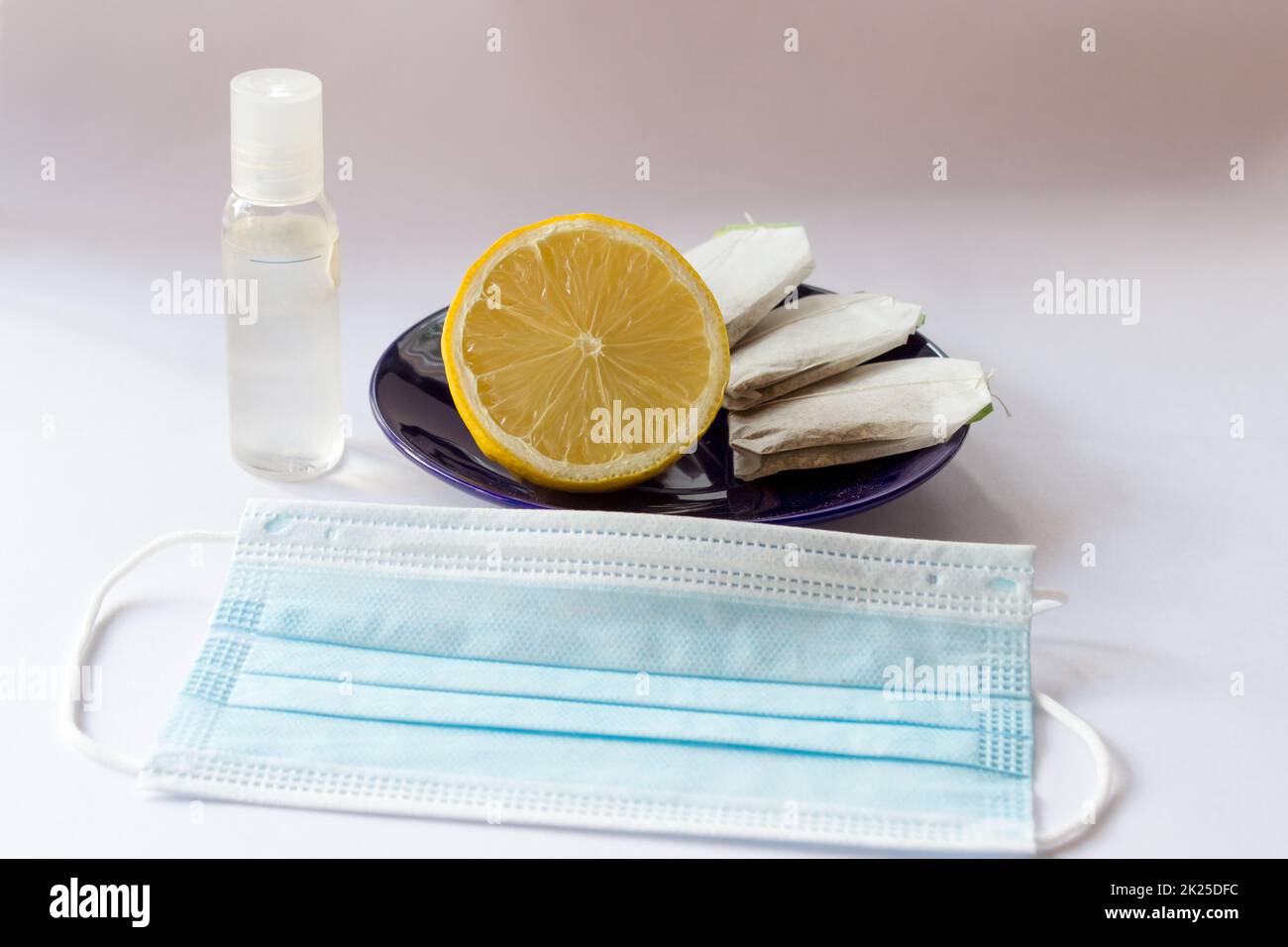 Mask drape lemon tea antibacterial disinfectant Stock Photo