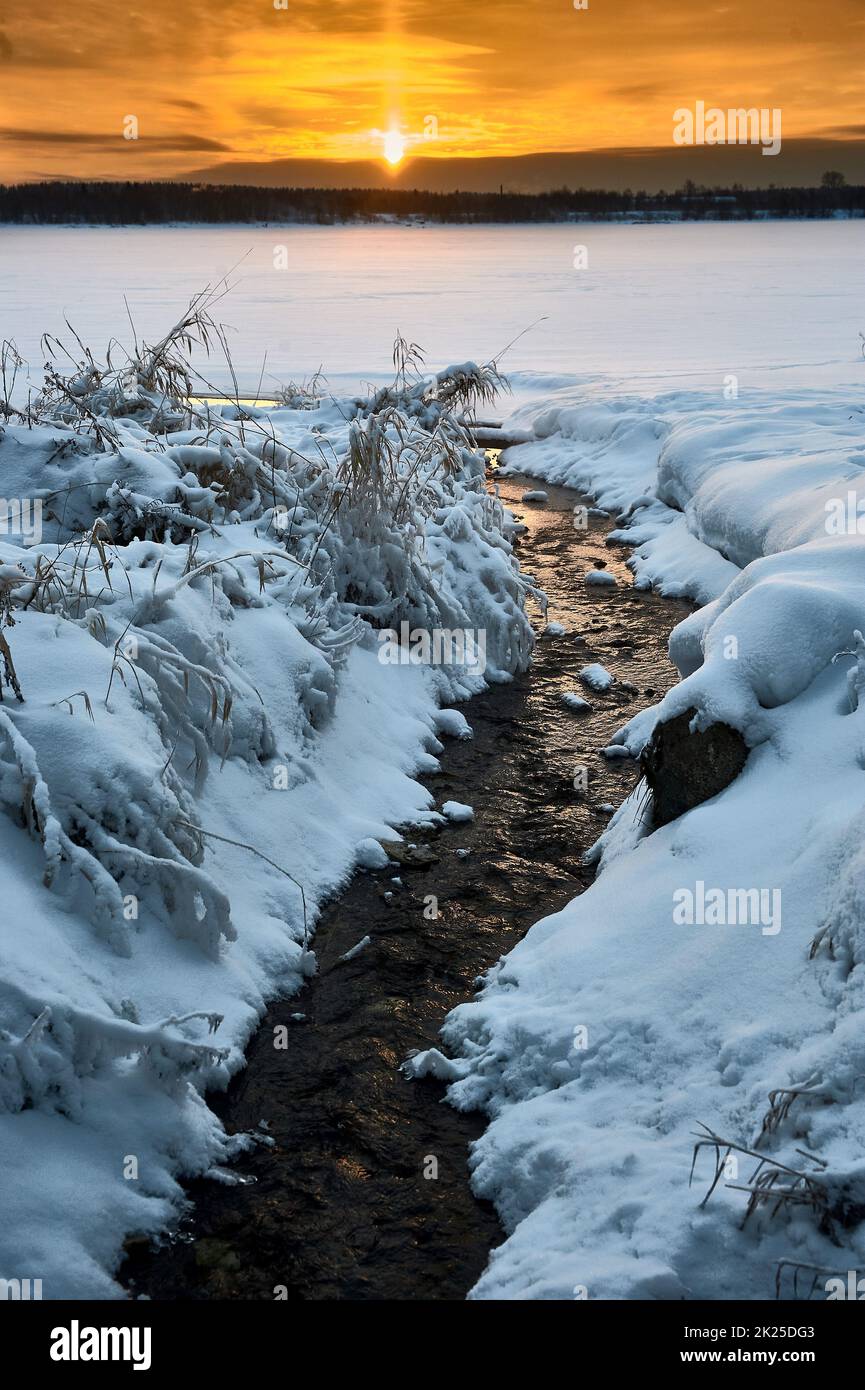 Winter sunset on the river in the month of January Stock Photo