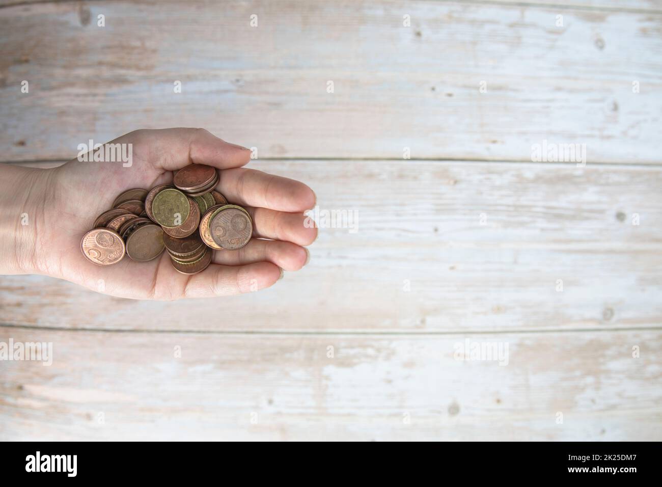 stack of metal coins neatly composed lie on a white wooden table Stock  Photo - Alamy