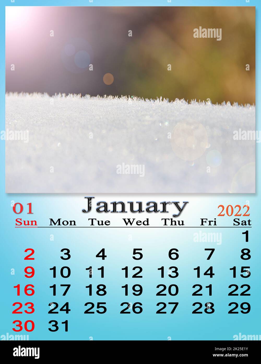 January 2022 Calendar image of surface covered by snow in sunny rays. M Stock Photo