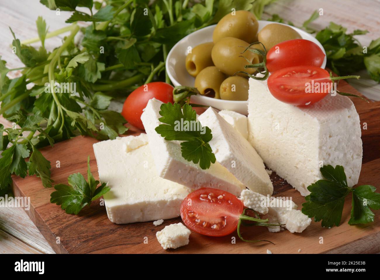 Feta cheese, olives and cherry tomatoes, green herbs and olive oil