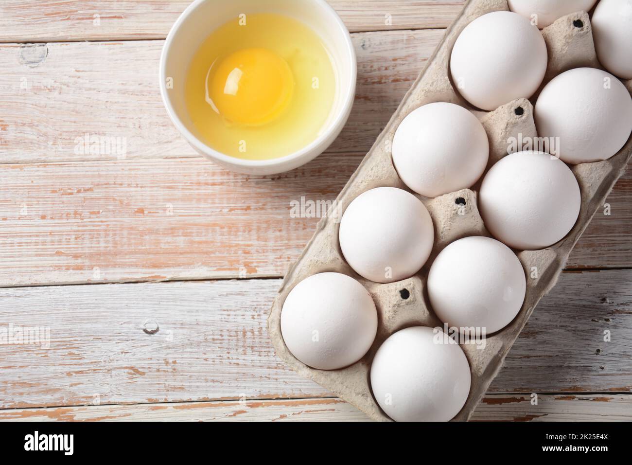 White eggs and egg yolk .Store bought chicken eggs in gray carton Stock