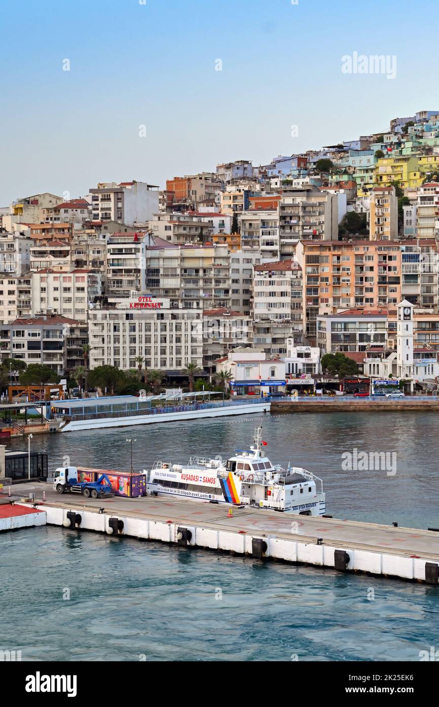Kusadasi, Turkey - May 2022: Small ferry moored in the town's harbour in early morning light Stock Photo