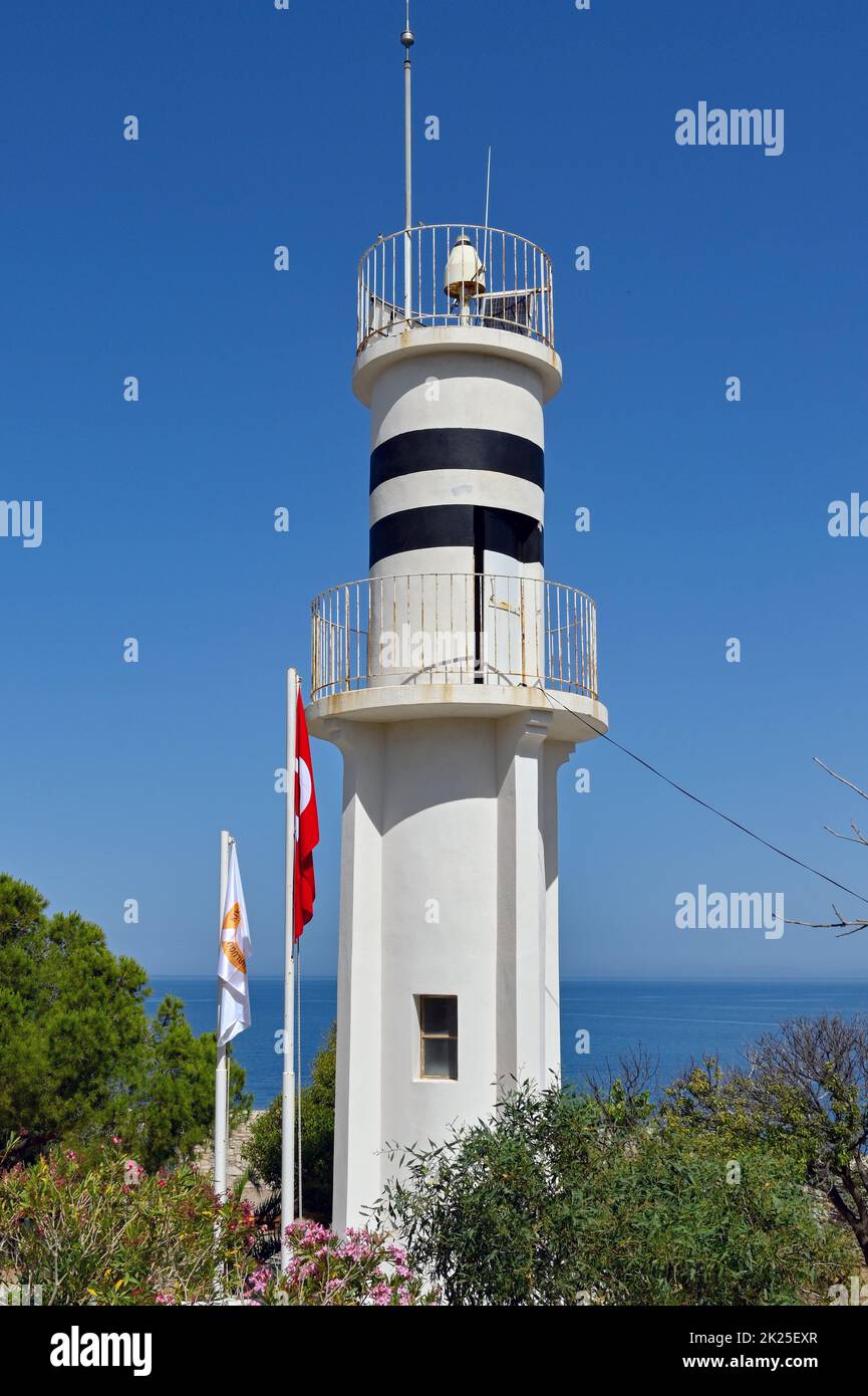 Kusadasi, Turkey - May 2022: Historic lighthouse on the tip of Pigeon island which is in the town's harbour Stock Photo