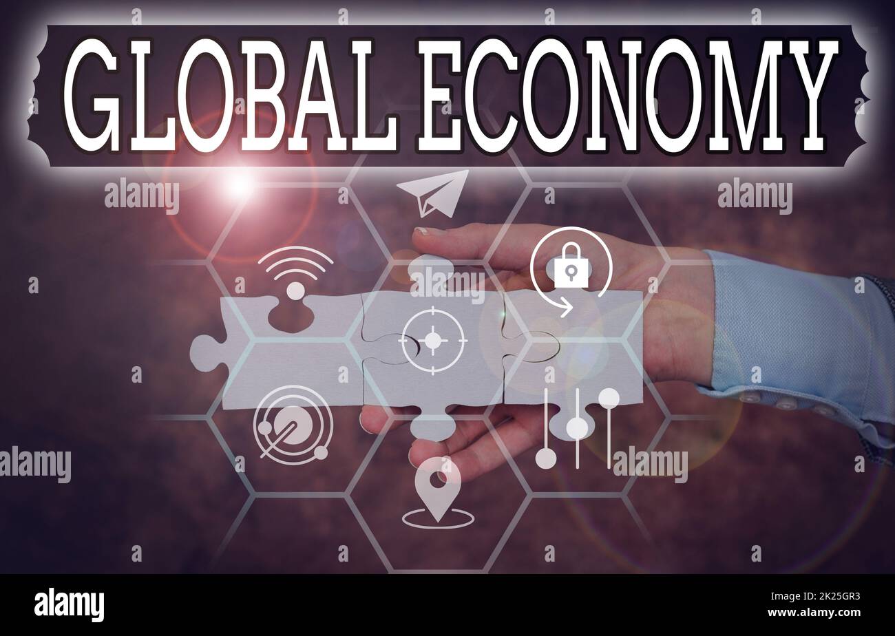 Conceptual display Global Economy. Business idea System of industry and trade around the world Capitalism Hand Holding Jigsaw Puzzle Piece Unlocking New Futuristic Technologies. Stock Photo