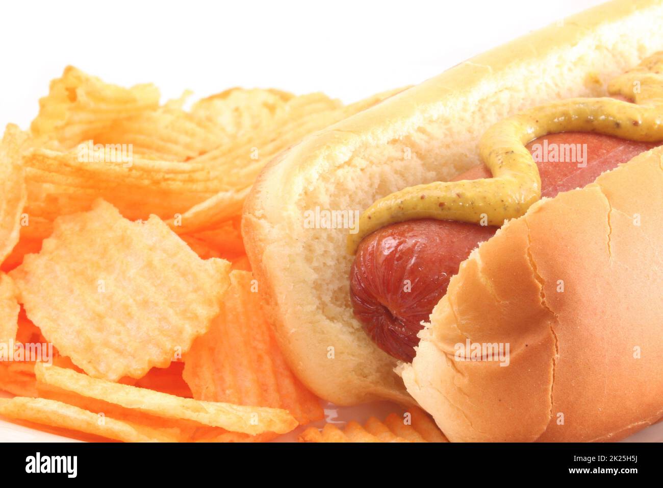 hot Dog With Mustard and Potato Chips Isolated on White Stock Photo