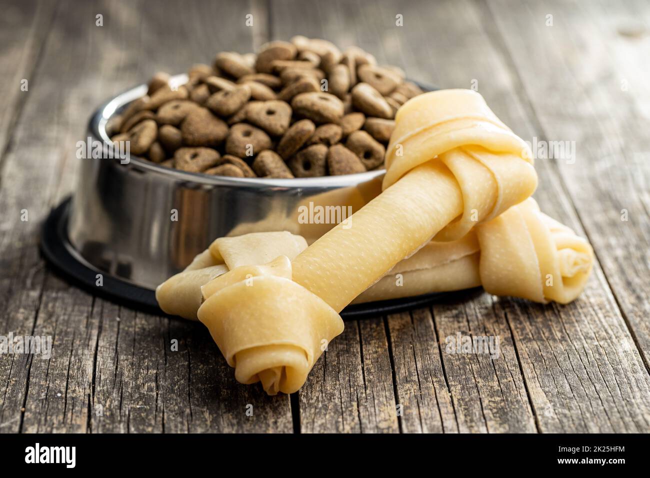 Delicacy for dogs. Chewing bone and dried food for dog Stock Photo