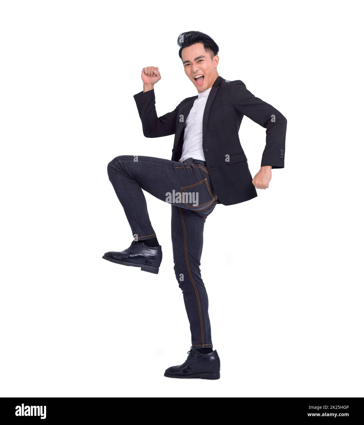 Excited young successful business man jumping and dancing Stock Photo ...