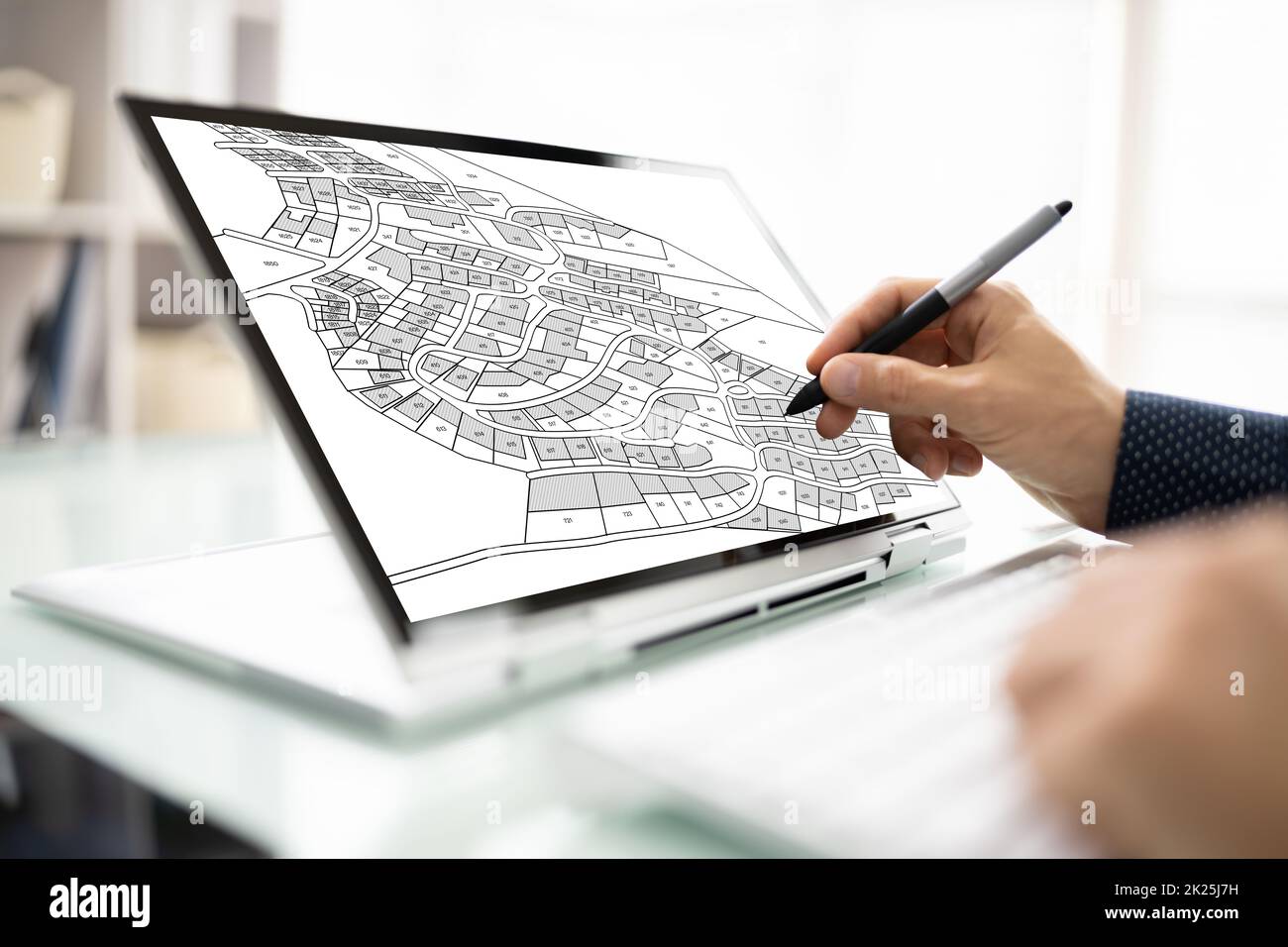 Male Executive Looking At Cadastre Map Stock Photo