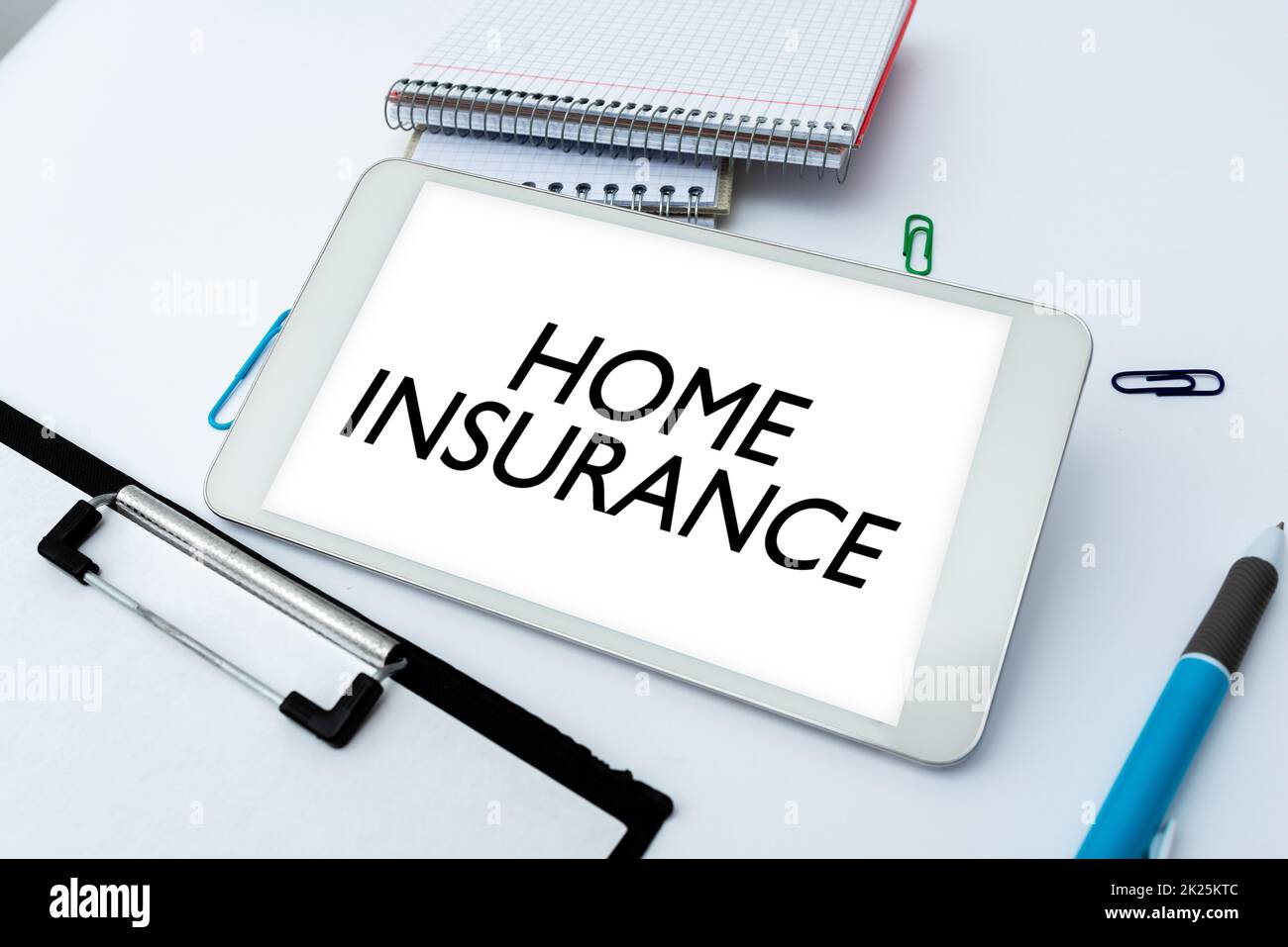Hand writing sign Home Insurance. Internet Concept Covers looses and damages and on accidents in the house Smartphone With Voice And Video Calls Device For Long Range Connections Stock Photo