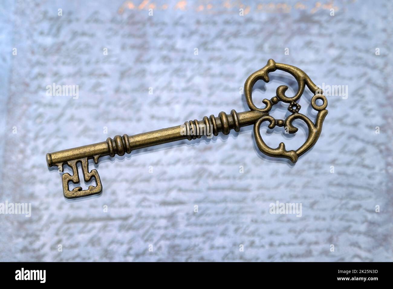 vintage key on a grungy blue leather background Stock Photo