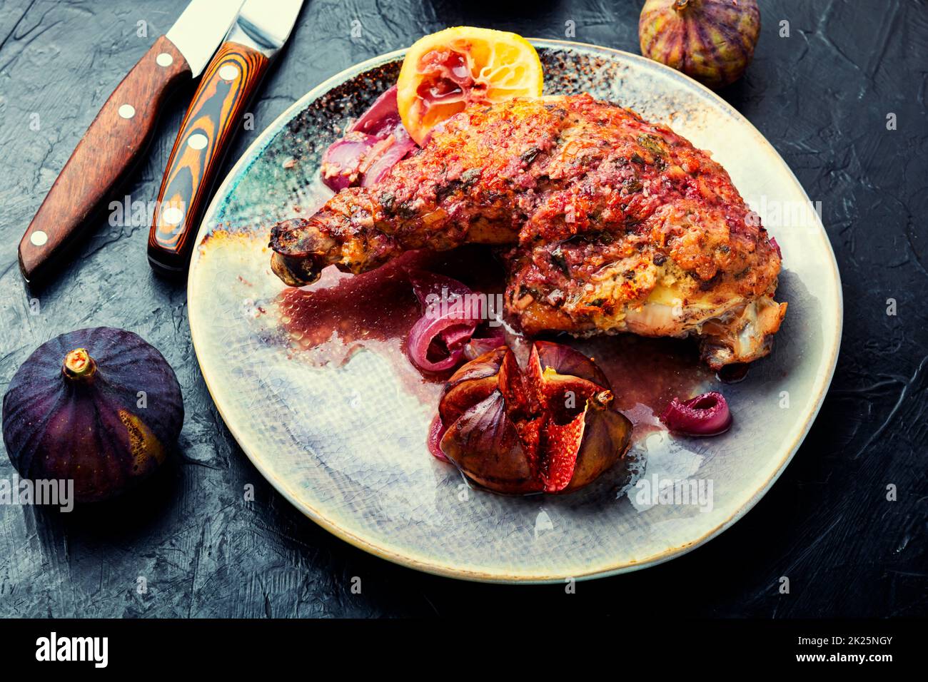 Chicken leg with figs in Greek Stock Photo Alamy