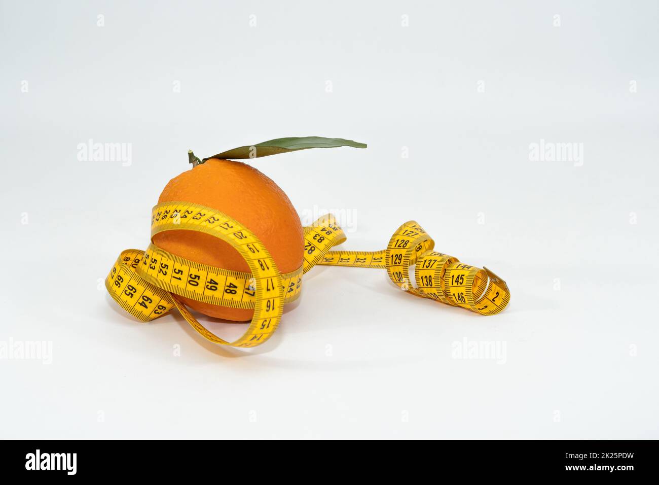 orange in close-up with tape measure Stock Photo - Alamy