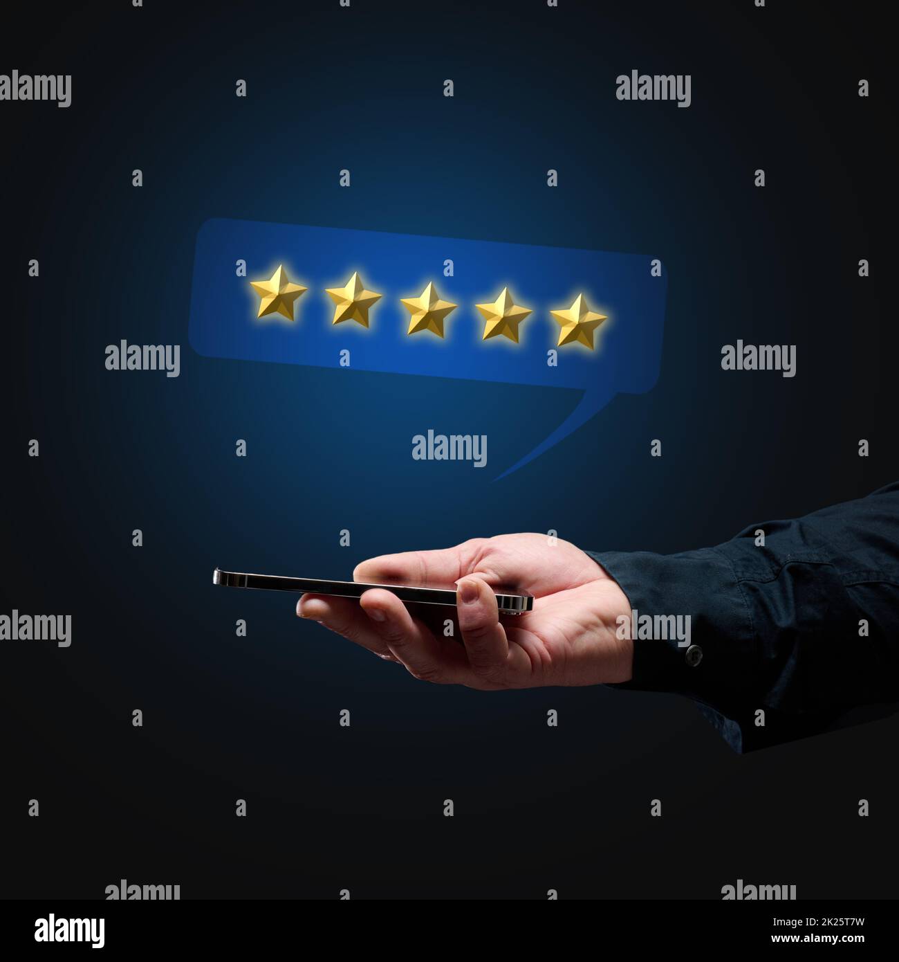 a man's hand holds a smartphone and five gold stars above it. App evaluation. User reviews Stock Photo