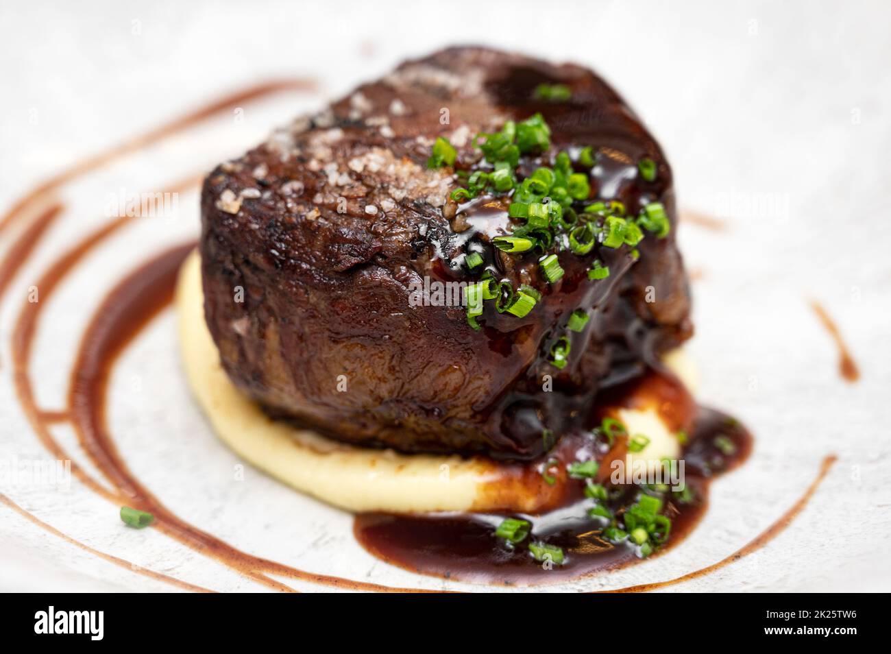 Medium Rare Fillet Mignon Steak with Herb Garlic Butter Stock Photo