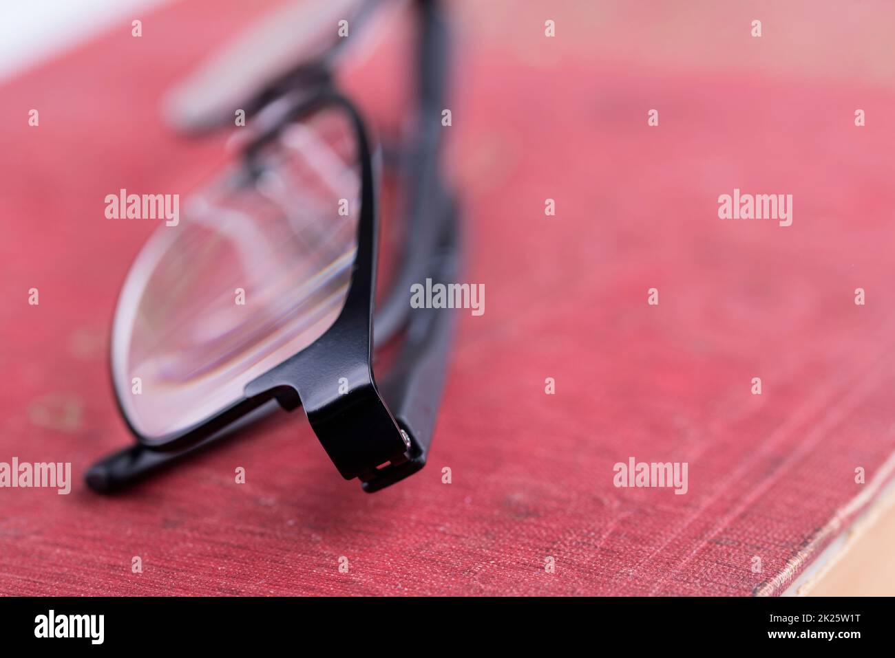 glasses on a old book Stock Photo