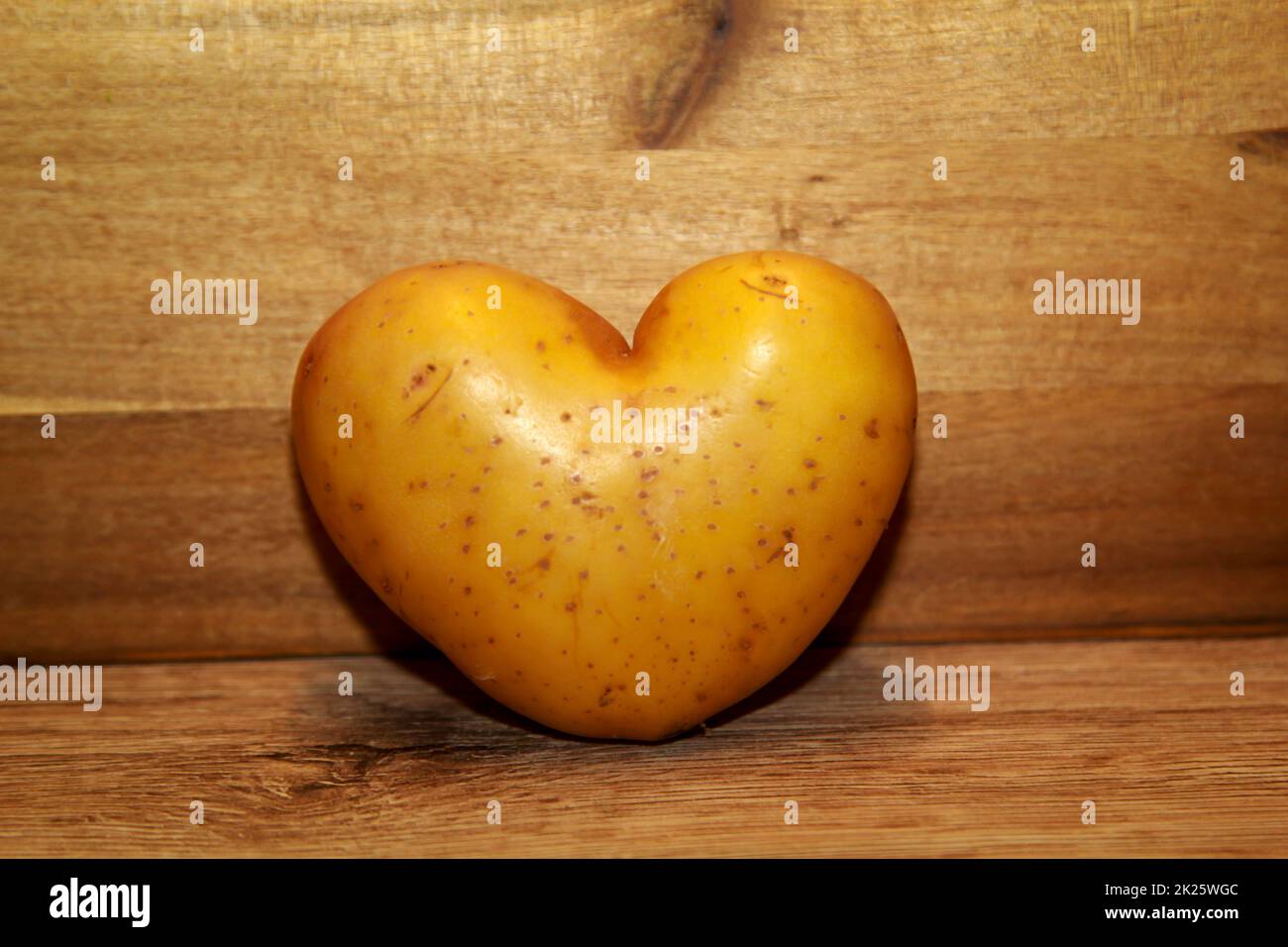 A potato in the shape of a heart. Potato love Stock Photo Alamy