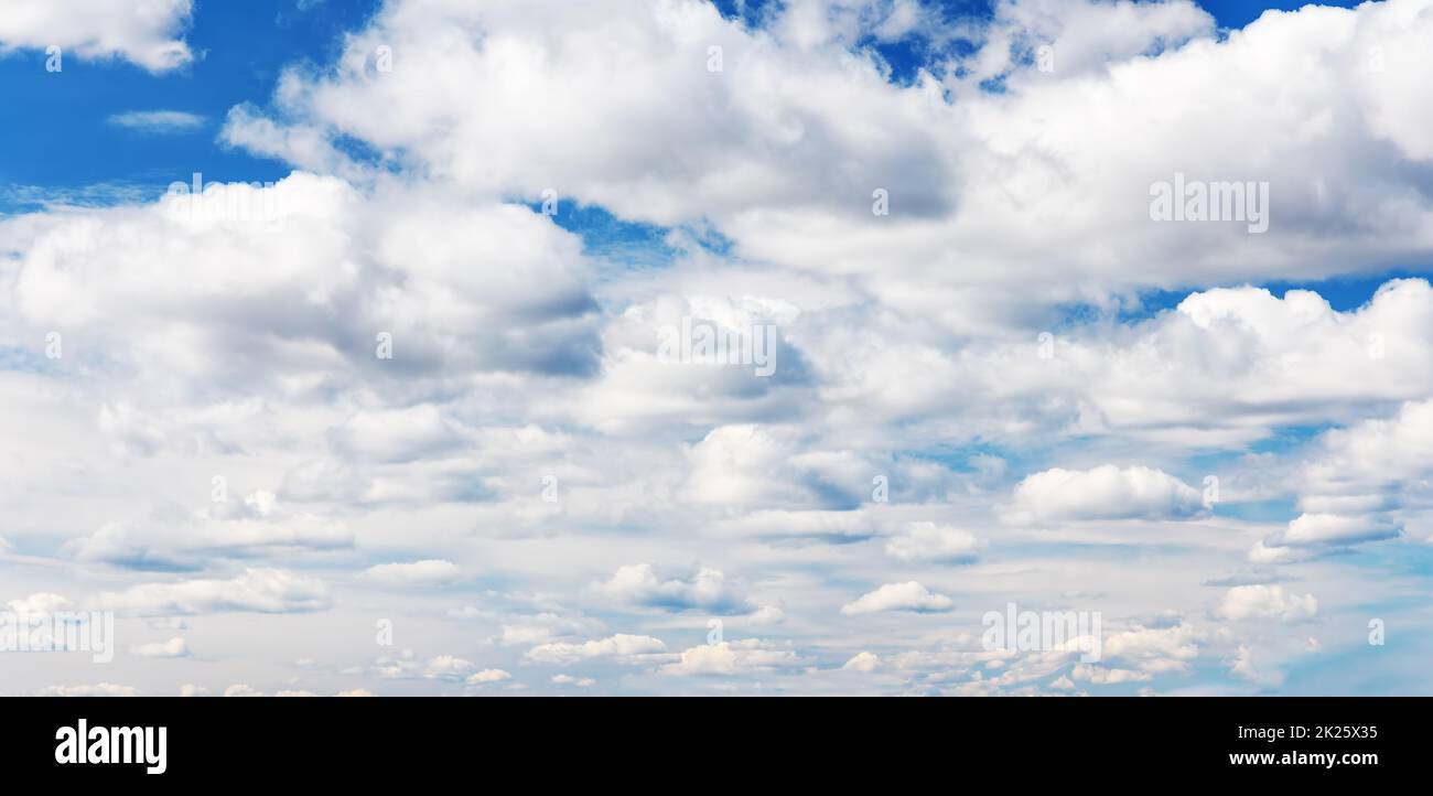 Blue sky with soft white clouds in sunny day Stock Photo