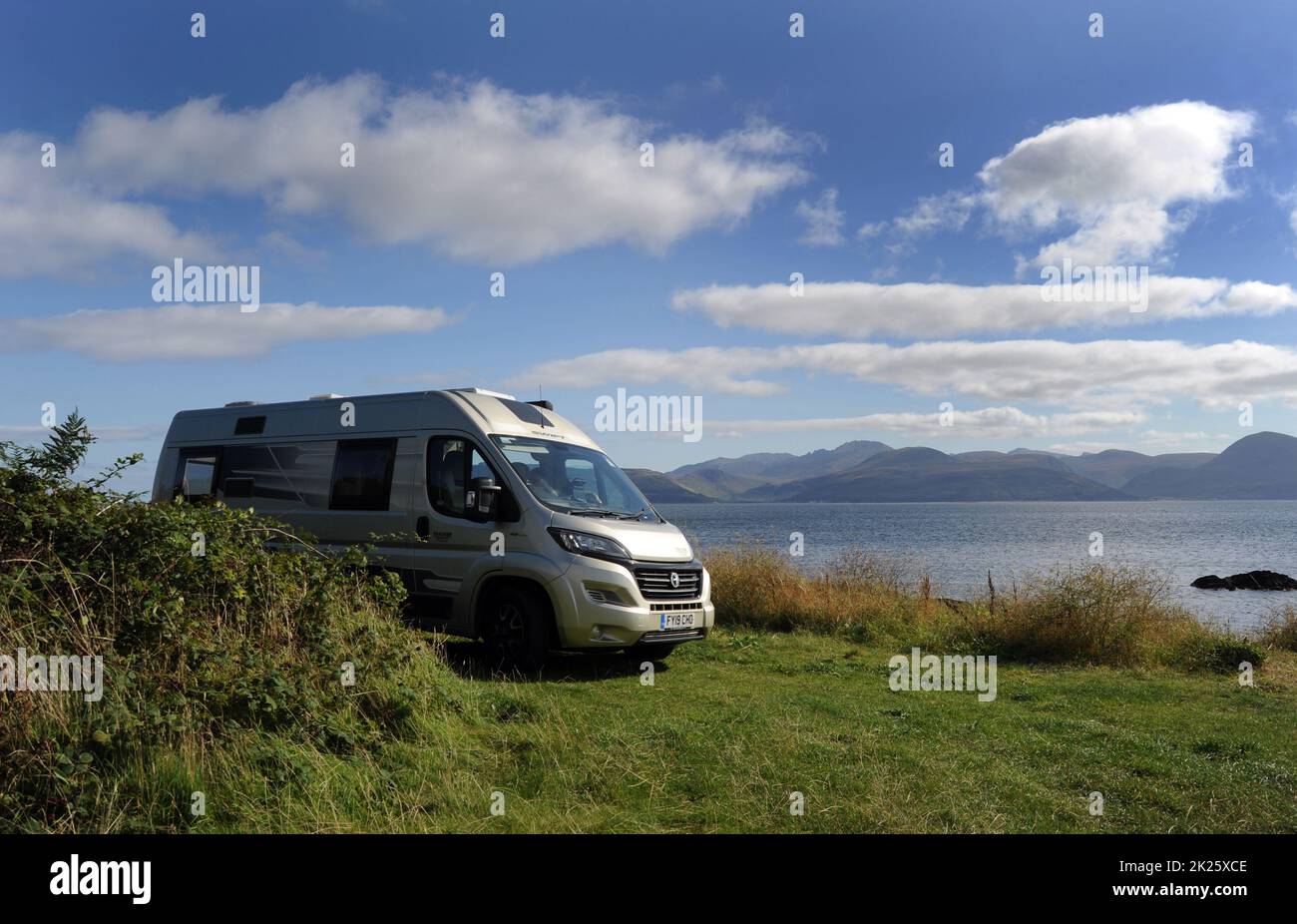 MOTORHOME PARKED LOOKING OUT TOWARDS THE ISLE OF ARRAN IN THE WEST OF SCOTLAND UK Stock Photo