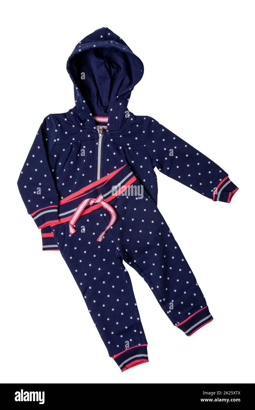 Closeup of a stylish fashionable dark blue hooded sweater with polka dots and a denim pants for the little girl. Children sport trousers and jacket with hood. Clipping path. Stock Photo