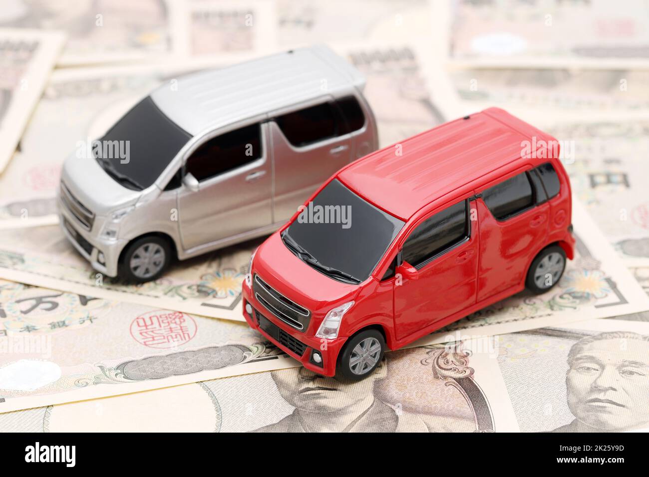 Small toy car image on Japanese ten thousand yen bills banknotes Stock