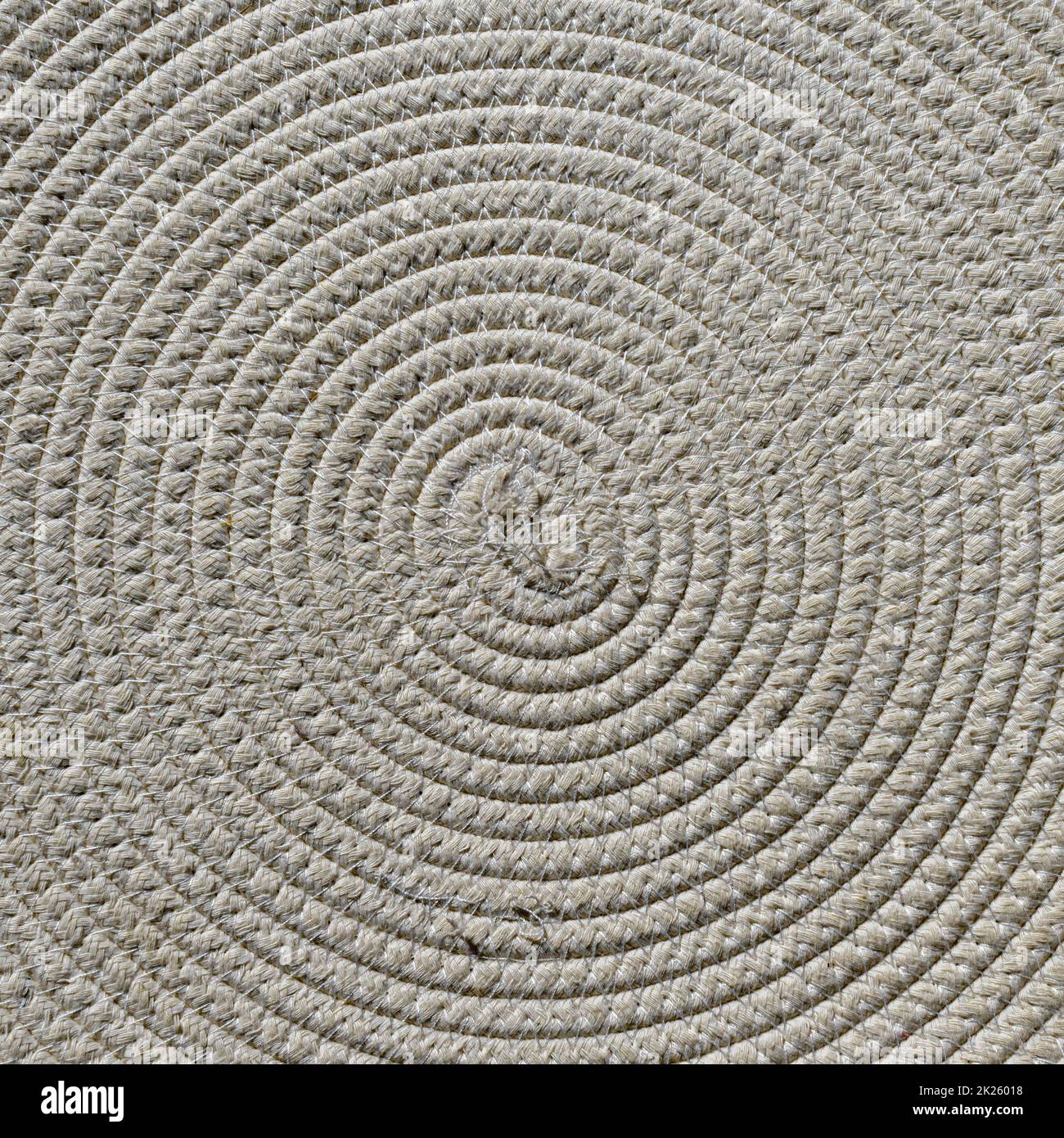 Concentric geometric pattern formed by woven natural fibers Stock Photo