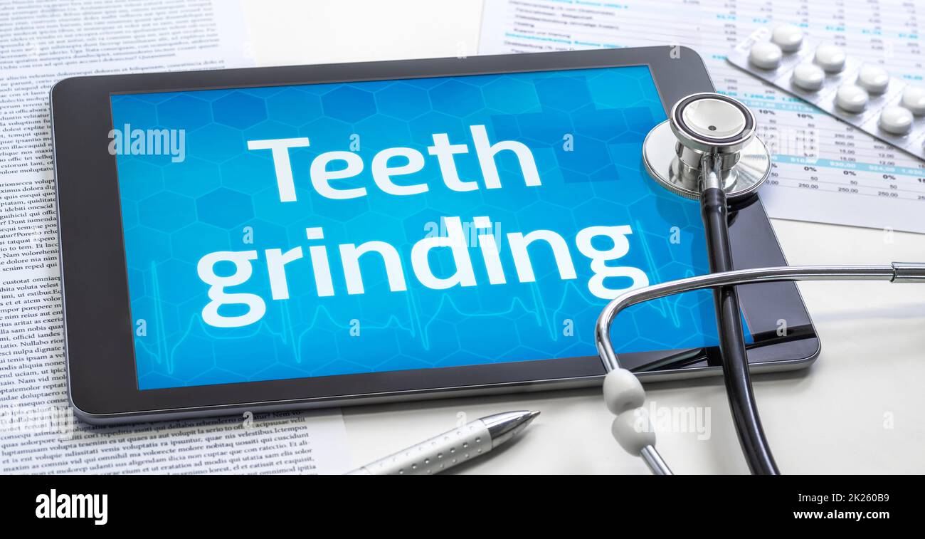 The word Teeth grinding on the display of a tablet Stock Photo