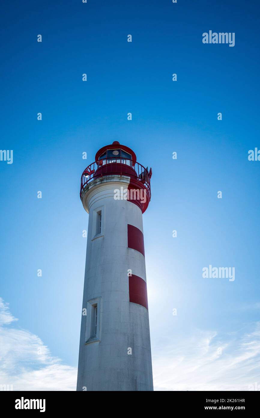 Old red lighthouse in La Rochelle harbor, France Stock Photo