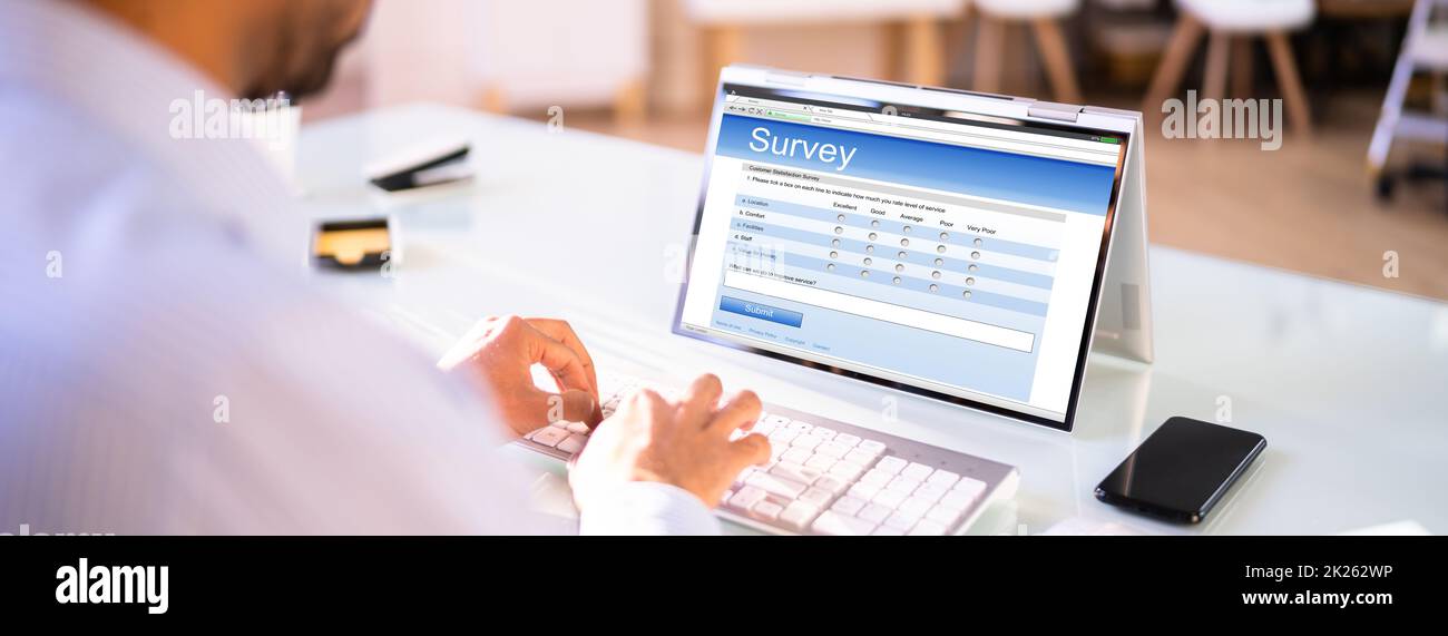 African Man Filling Survey Poll Or Form Stock Photo - Alamy