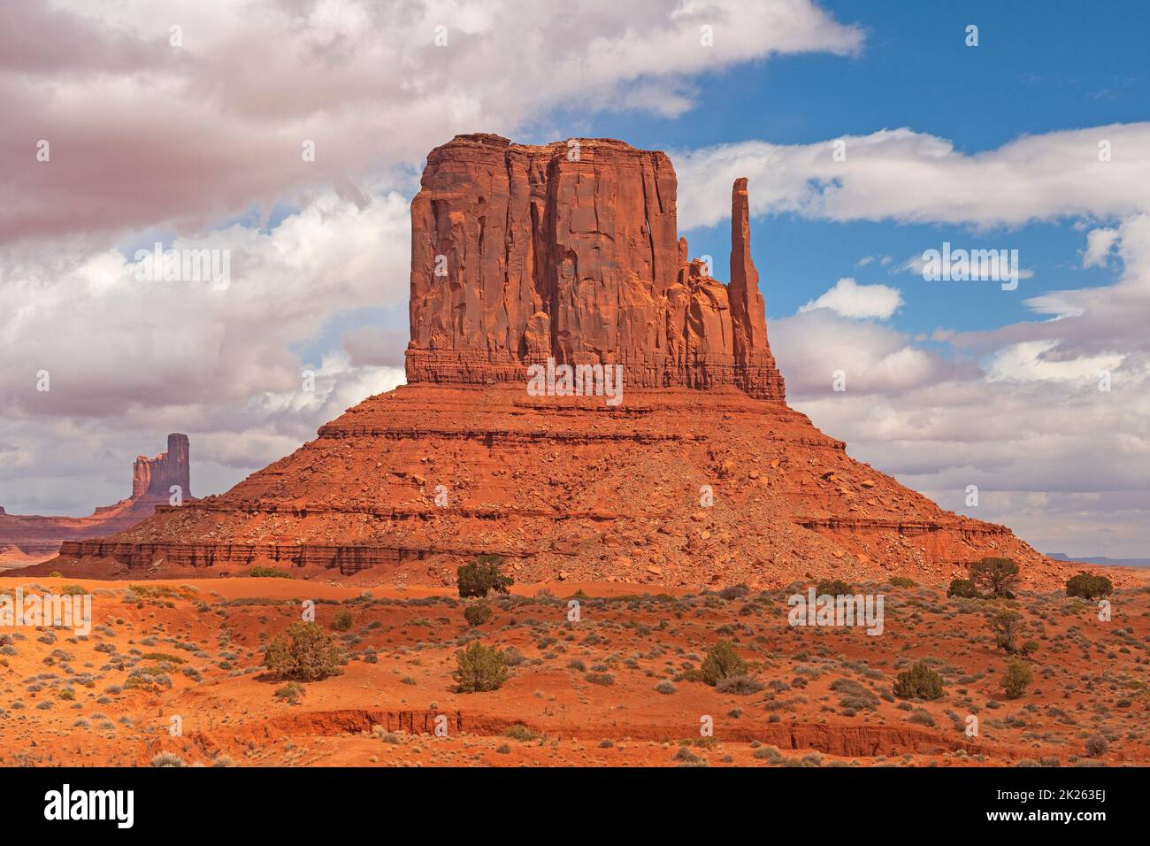 Dramatic Butte Rising From the Red Sands Stock Photo