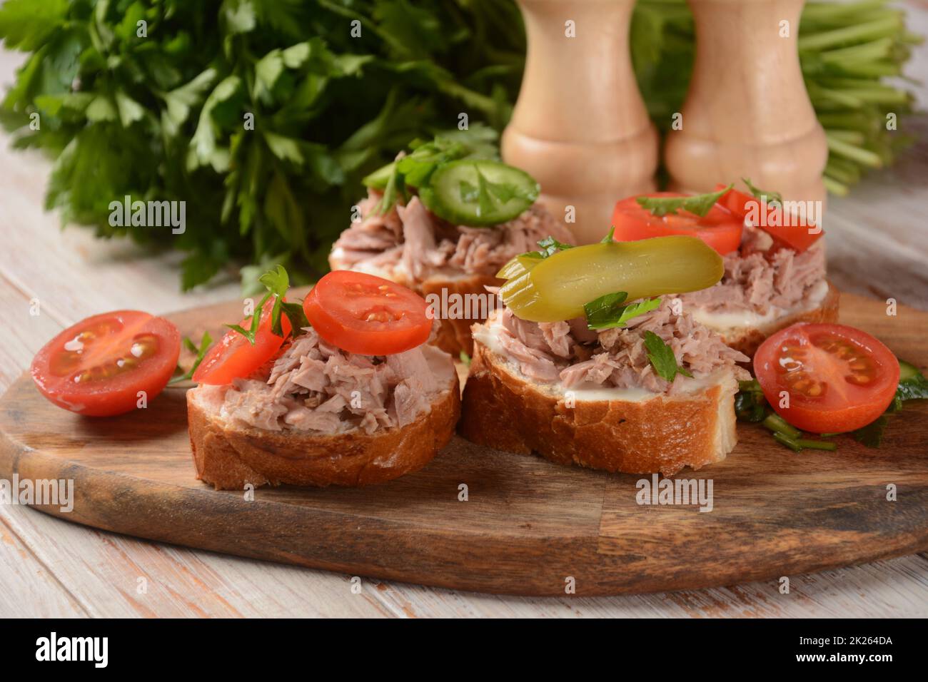 Open sandwich with canned tuna, cucumber, tomatoes, pickled cucumber Stock Photo