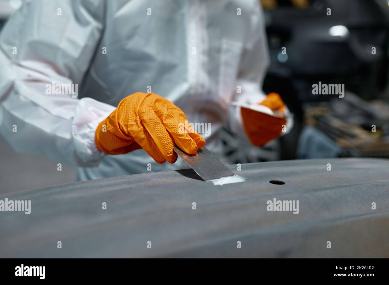 Mechanic engaged in local repairing car body Stock Photo