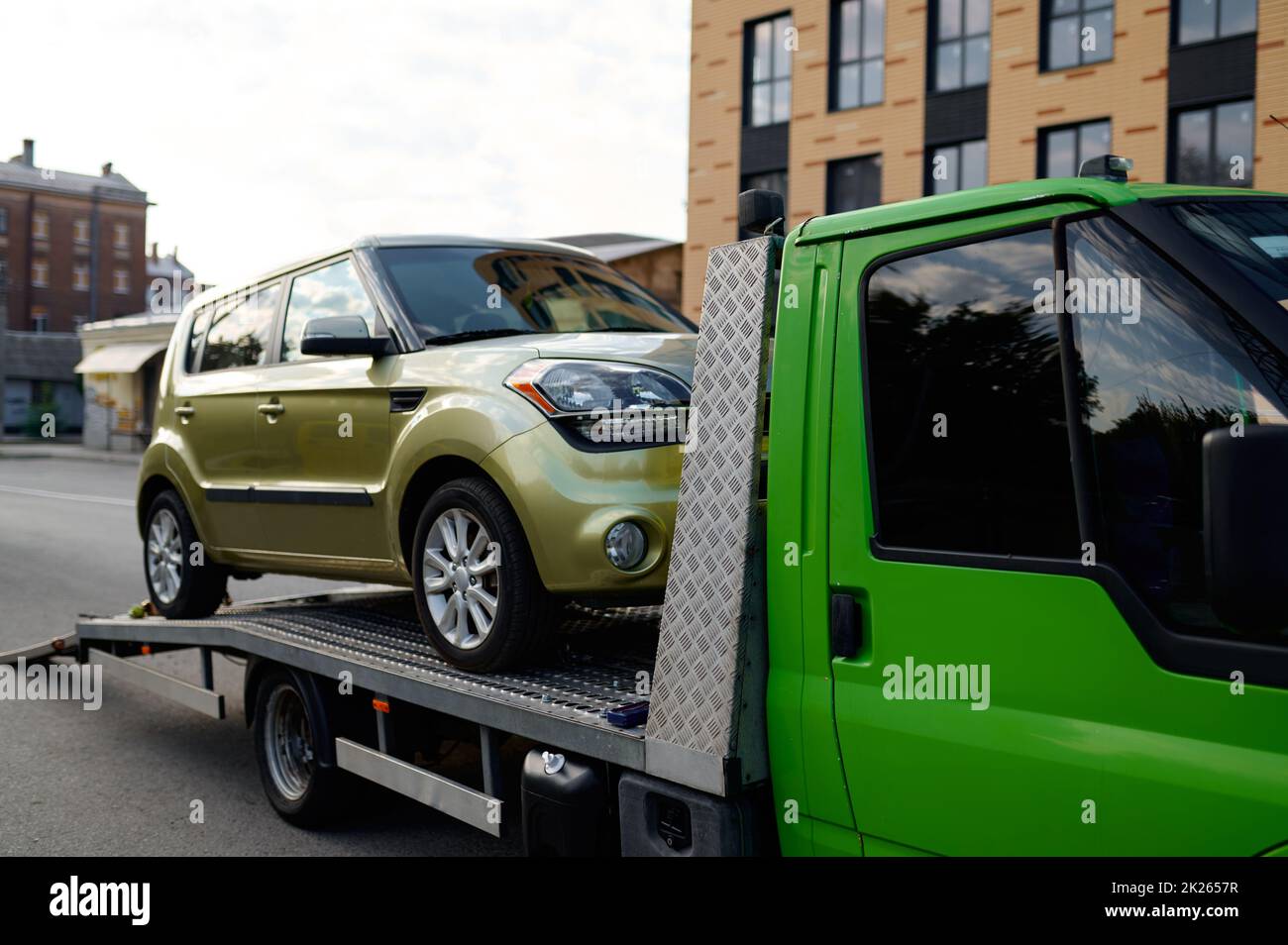 Tow track vehicle taking away broken car Stock Photo