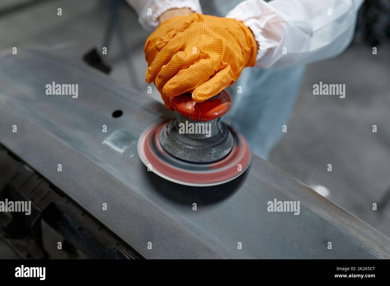 Closeup auto mechanic hands with orbital polisher Stock Photo