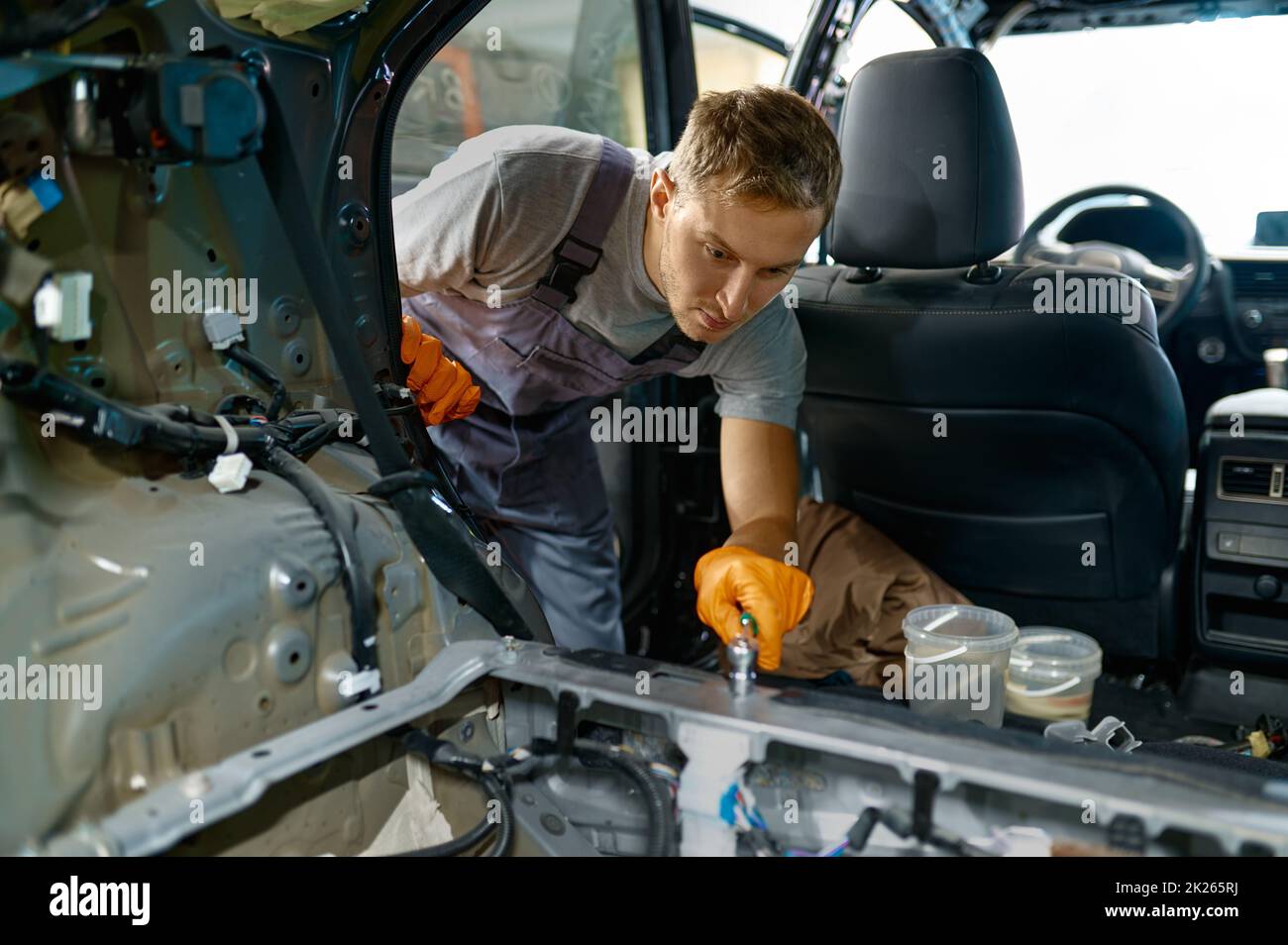 Automotive worker engaged in car body work Stock Photo Alamy