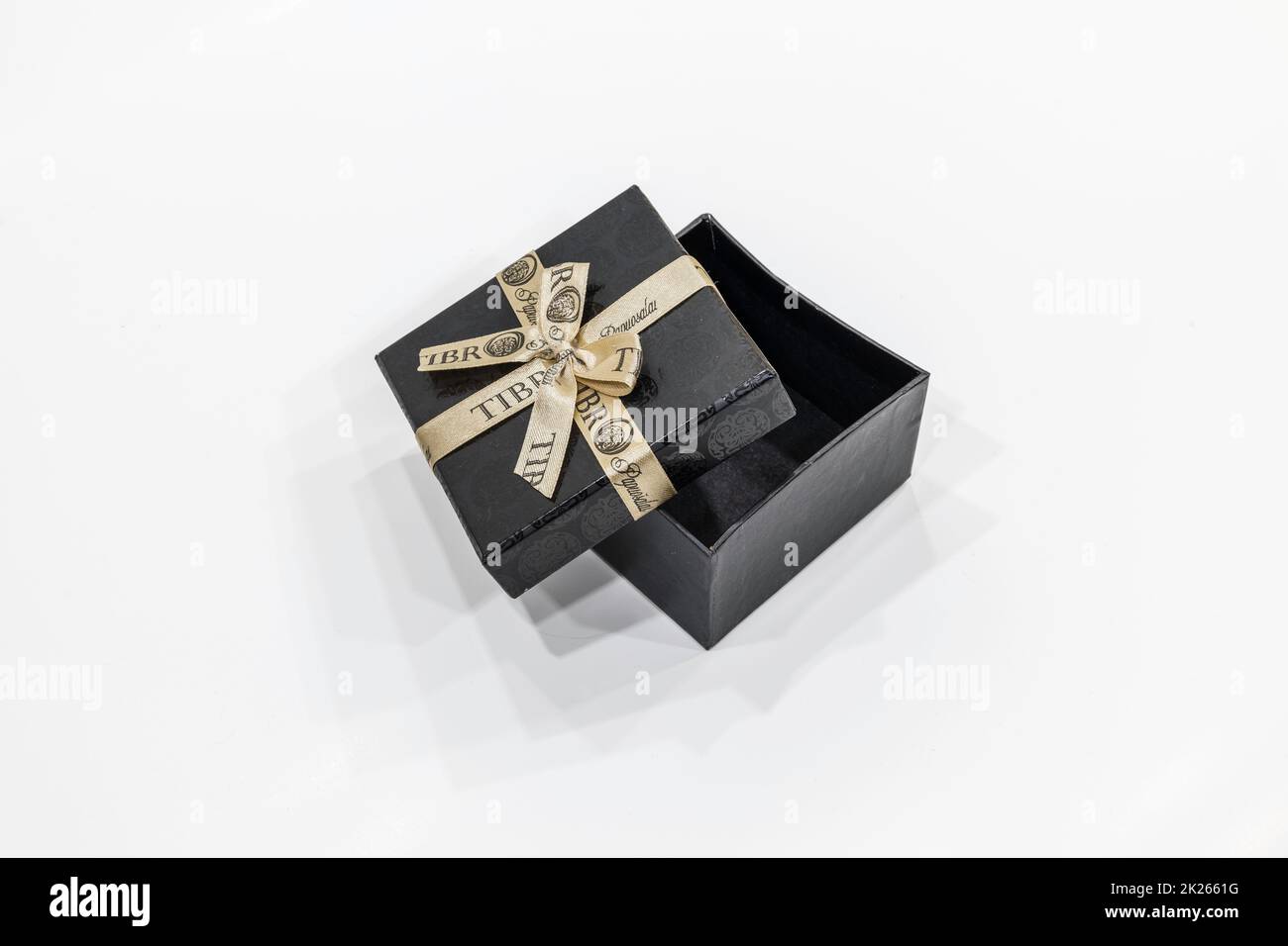 open black gift box with a ribbon isolated on a white background. For Valentine's Day, Women's Day, Christmas and New Year's Stock Photo