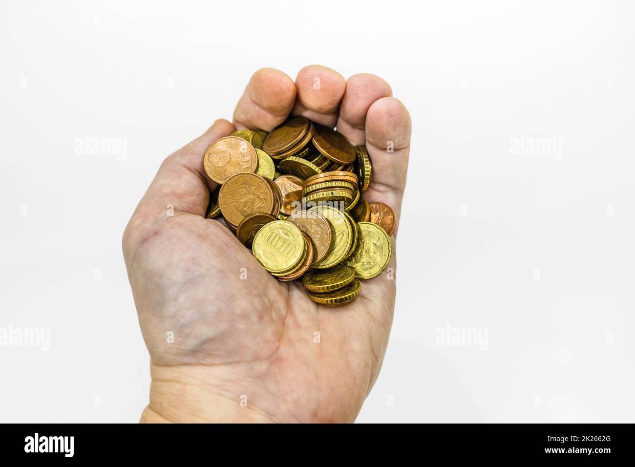 hand holding euro coins on white background Stock Photo - Alamy