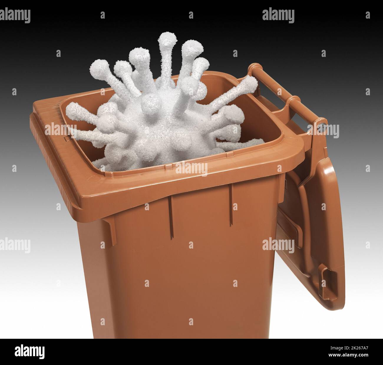 open waste container with symbolic virus in it Stock Photo