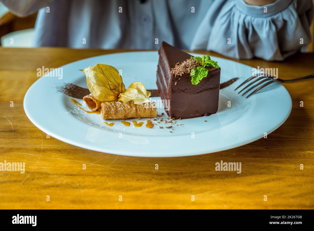 The Perfect Chocolate Cake. Slice of delicious chocolate cake decoration with fruit Stock Photo