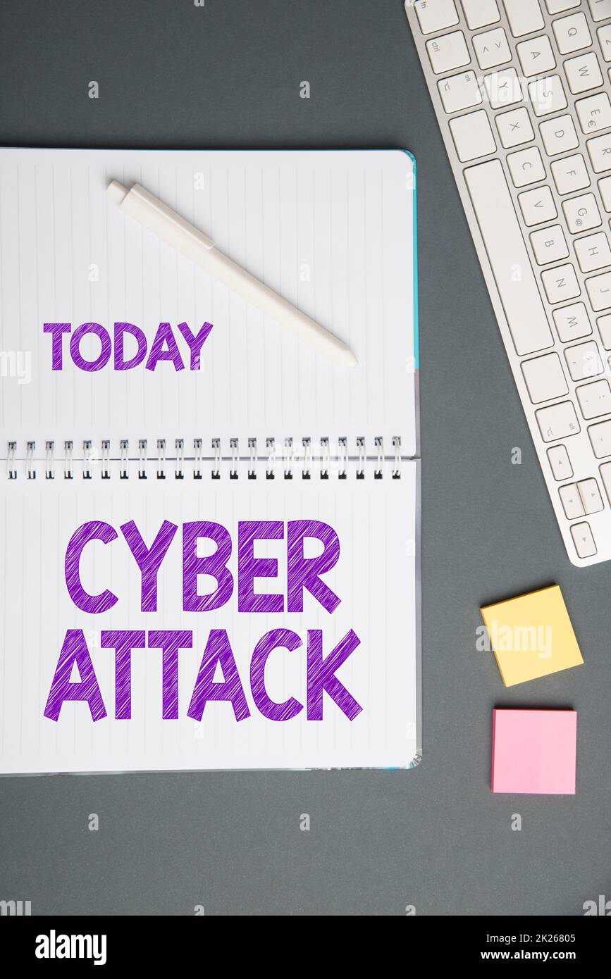 Text caption presenting Cyber Attack. Word Written on An attempt by hackers to Damage Destroy a Computer System Keyboard Over A Table Beside A Notebook And Pens With Sticky Notes Stock Photo