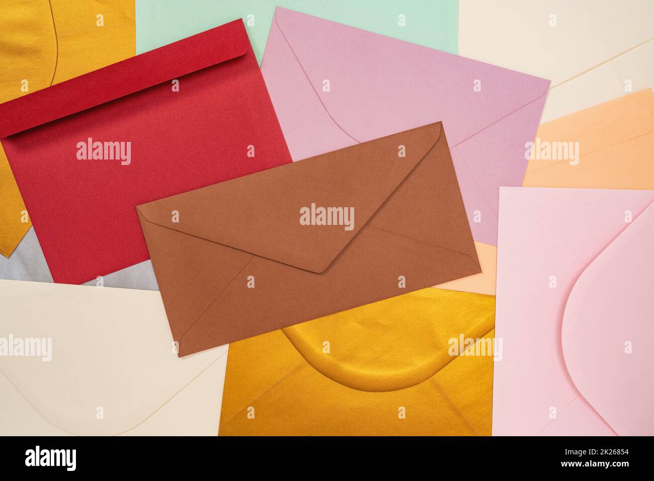 Heap of colorful envelopes on the desk Stock Photo