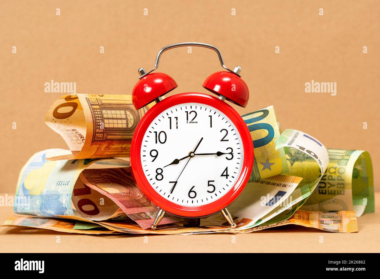 Retro style alarm clock and Euro currency Stock Photo