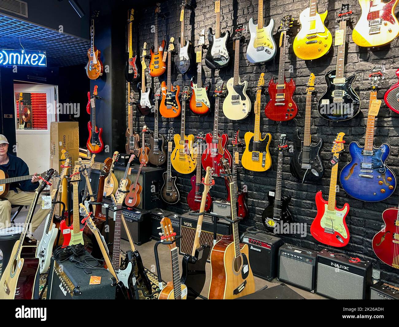 Paris, France, Collection Used Guitars Display on Wall, inside, Recycling Consumer Goods Store in Beaubourg Neighborhood 'Upcycling en Cours...' Stock Photo