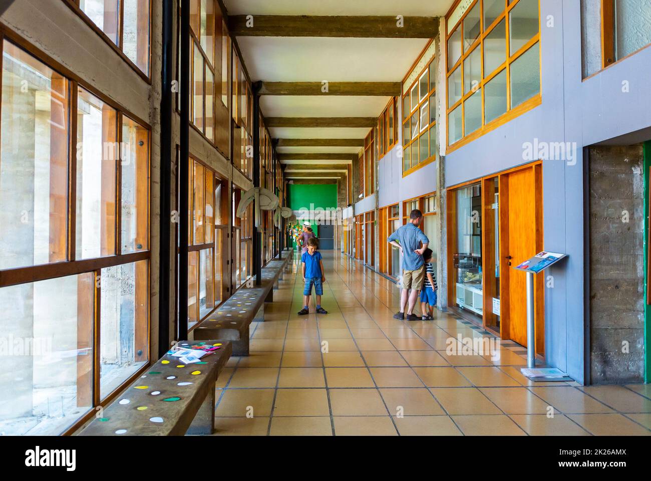 Marseille, France, Tourist Family Visiting inside Modern Public Aprtment Building, CIte Radieuse, by Le Corbusier, French Architect Stock Photo