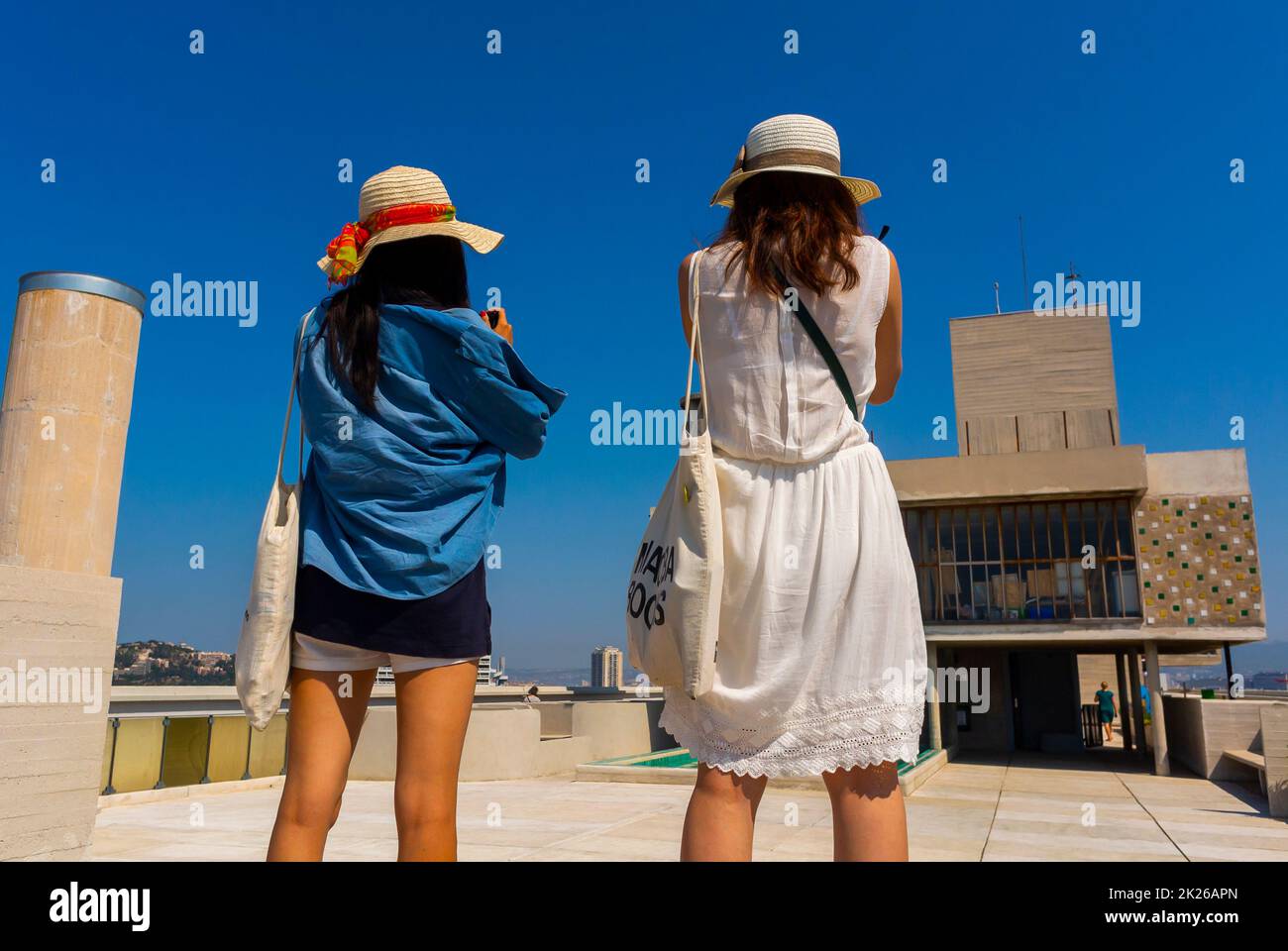 Marseille, France,  Modern Art, Tourists Visiting, Girls Taking Photos from Behind, on Rooftop, Public Apartment Building, CIte Radieuse, by Le Corbusier, French Architect Stock Photo