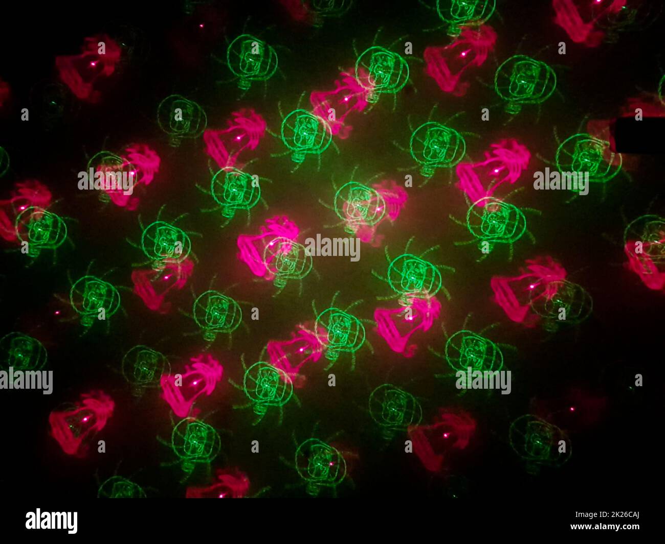 Beautiful shot of laser lights with star and firework shapes on the