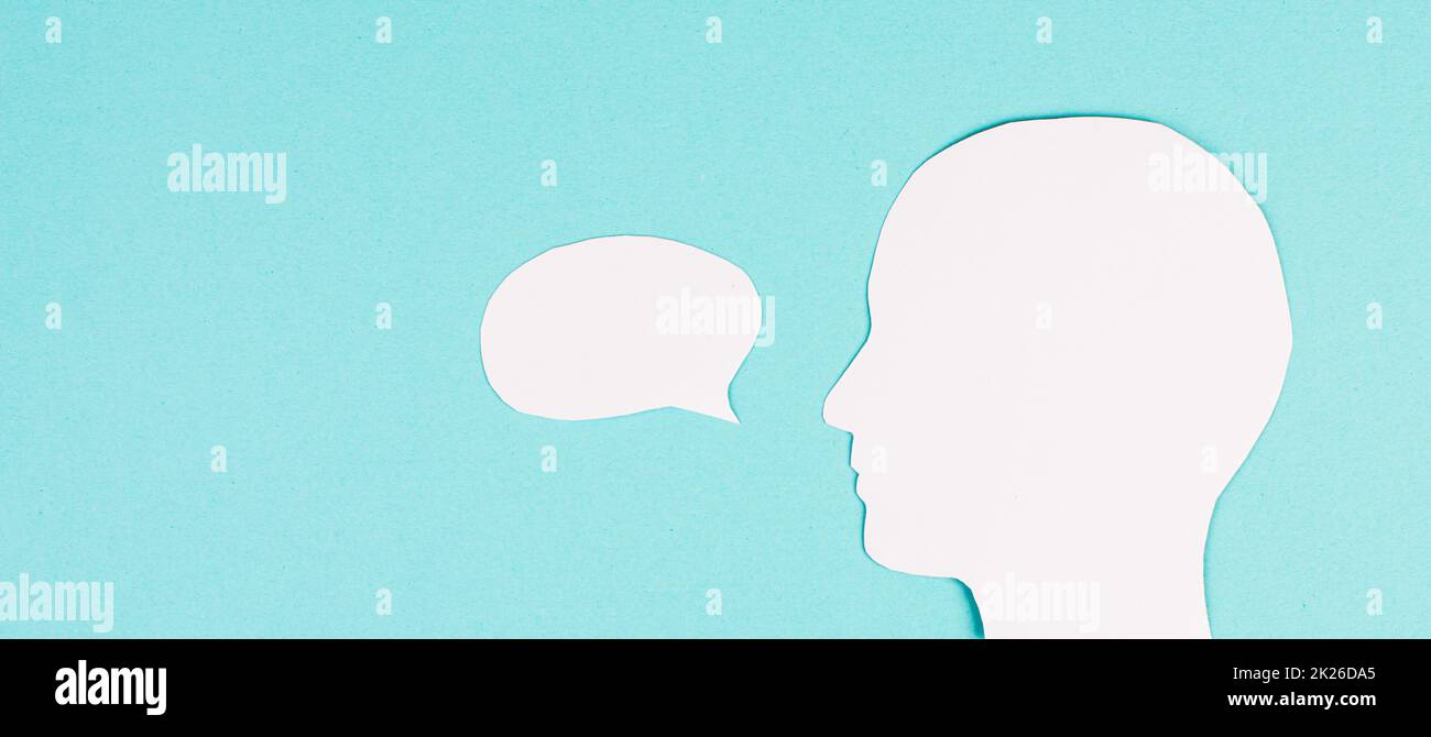 Silhouette of a face, speech bubble in white color, copy space for text, communication, having an opinion, free speech Stock Photo