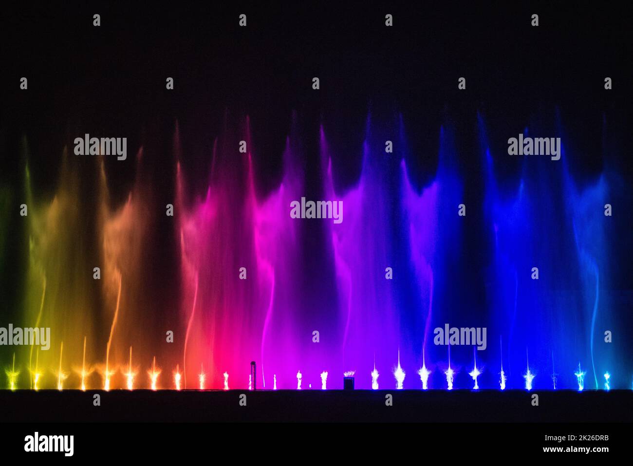 Beautiful fountain dancing show with reflection on water at night Stock ...