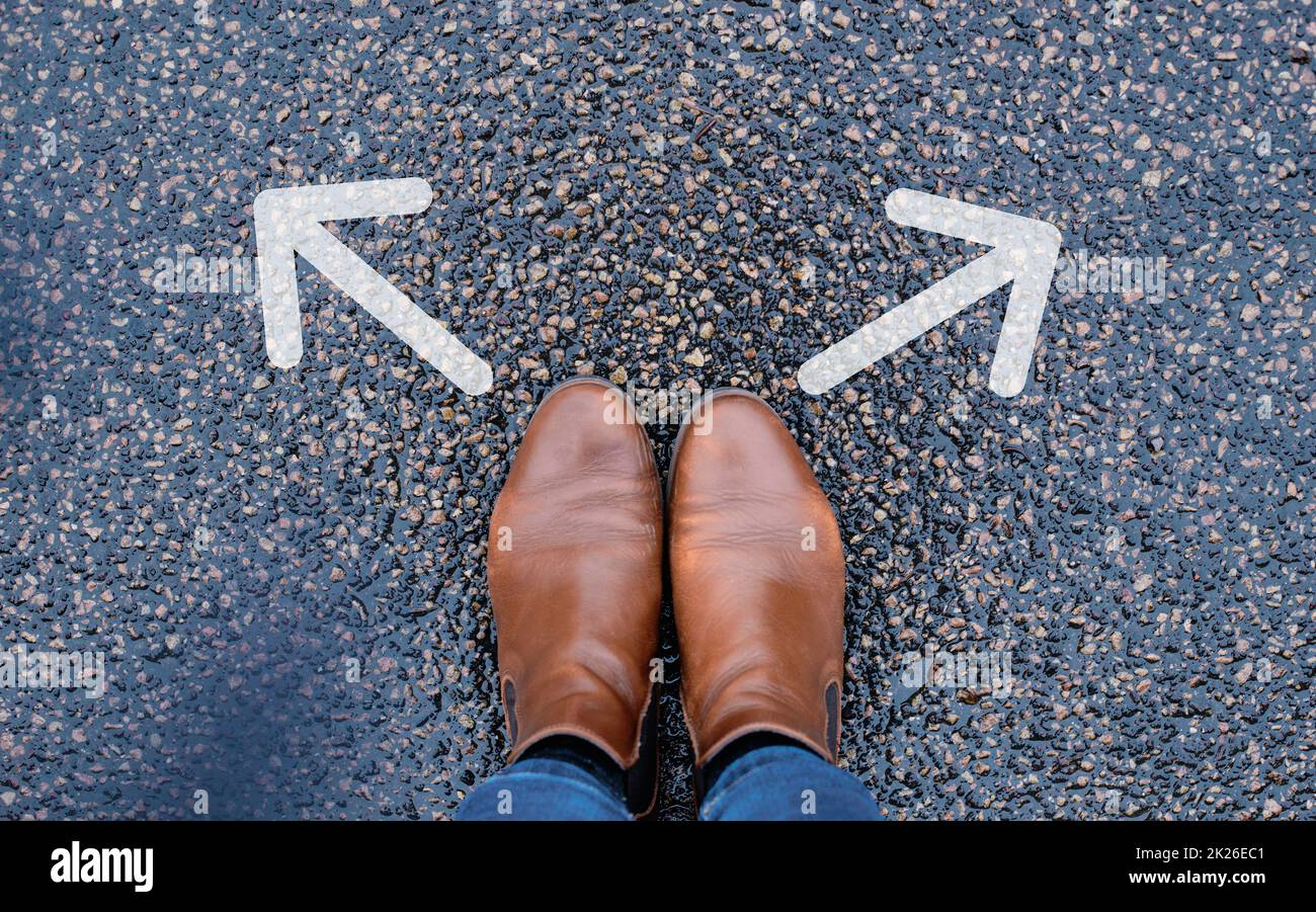 Standing on a junction, choosing a direction, new oppurtunity, decision making concept, following a path Stock Photo