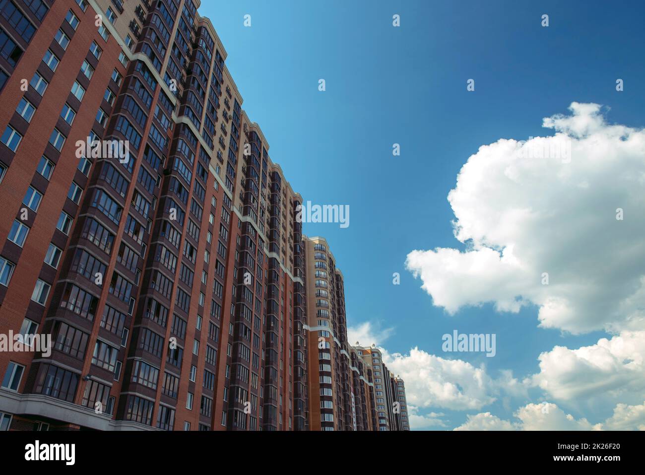 Multi-storey building on a background of blue sky Stock Photo - Alamy
